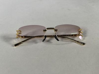 a pair of glasses sitting on top of a table