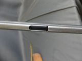 a close up of an umbrella with a wooden handle