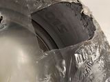 a tire that has been wrapped in plastic to protect it from the sun