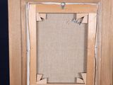an old wooden easel with a picture frame on top of it