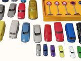 many different types of toy cars in a yellow box