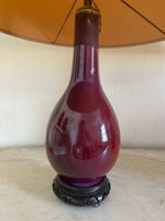 PAIRE DE VASES EN CERAMIQUE SANG DE BOEUF montés en lampe.