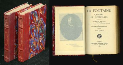 an open book sitting on top of a table next to a picture of a man