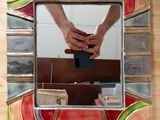 a person taking a picture of themselves in a mirror