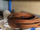 a bunch of hoses that are sitting on a shelf