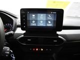 a car dashboard with a steering wheel and a touch screen