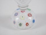 a glass vase with a colorful design on it