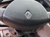 the steering wheel of a car with a diamond emblem on it