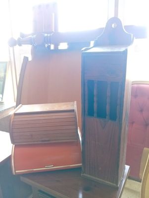 books are stacked on a table in front of a window