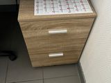 a desk with a calendar on it next to a computer
