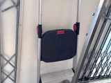 an image of a folding chair next to a wall