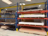 a room with a lot of shelves that have mattresses on them