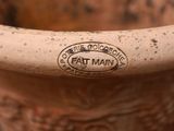 a close up of a vase with a label on it