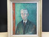 painting of a man in a suit and tie in a frame on a table