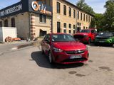 cars parked in front of a building in a parking lot