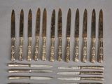 several knives and knives are lined up on a table