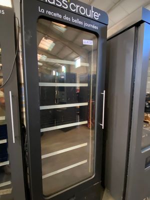 a large glass door that is open in a room