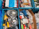 many boxes of assorted items sitting on the floor