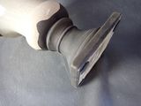 a close up of a person ' s foot with a brush in it