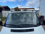 a picture of a white van parked in a lot
