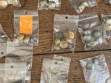 a lot of christmas ornaments in bags on a table
