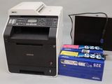 a photo of a printer and a computer on a table