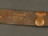 a close up of a leather belt with buttons on it