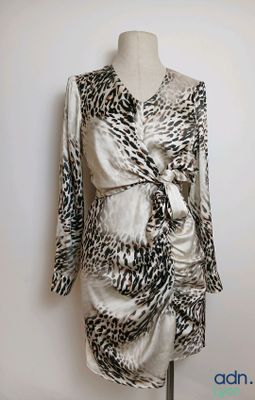 a picture of a dress on a mannequin stand