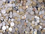 a lot of coins that are on the table