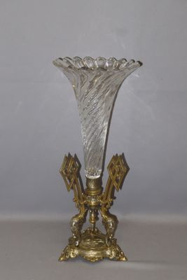 a glass vase that is sitting on a table