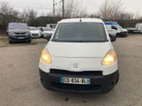 a white van parked in a parking lot next to other cars