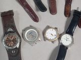 several different types of watches laid out in a circle on a table