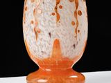 a glass vase that is sitting on a table