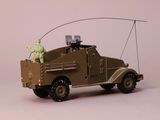 a toy army vehicle with a man on the back of it