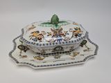 a white plate with a blue and white design on it