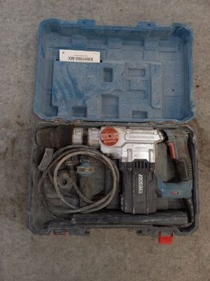 a box with a drill and a cord in it