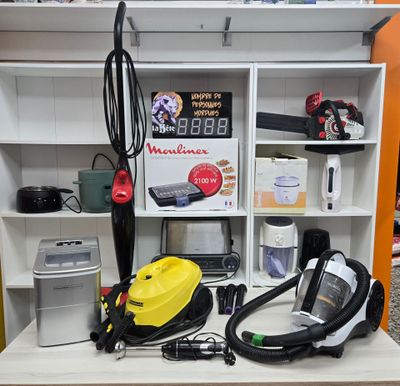 a yellow and black vacuum sitting on top of a white shelf