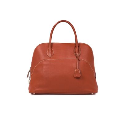 an image of a brown leather handbag on a white background