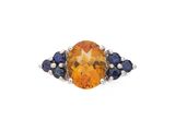 une bague ovale sertie d'une citrine et d'un saphir