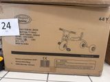 une boîte en carton sur laquelle est représenté un tricycle