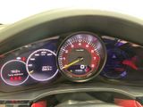 a close up of a car dashboard with various gauges