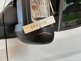 an image of a parking meter with a sticker attached to it