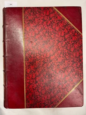 un vieux livre rouge aux tranches dorées et à la couverture rouge