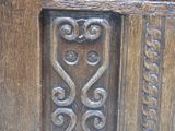 a close up of a wooden door with a decorative design