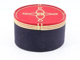 a red and black box with a gold design on it