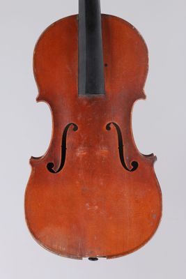 an old violin with a bow hanging from it ' s back