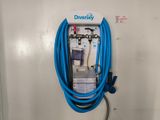 a blue hose attached to a white wall with a blue hose attached to it