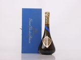 an image of a bottle of champagne next to a blue box