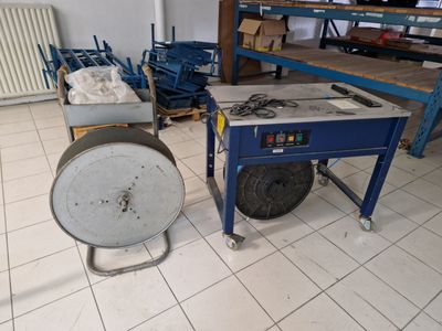 a machine that is sitting on the floor next to a table