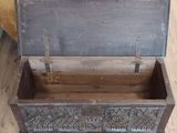 a wooden box that is sitting on the floor